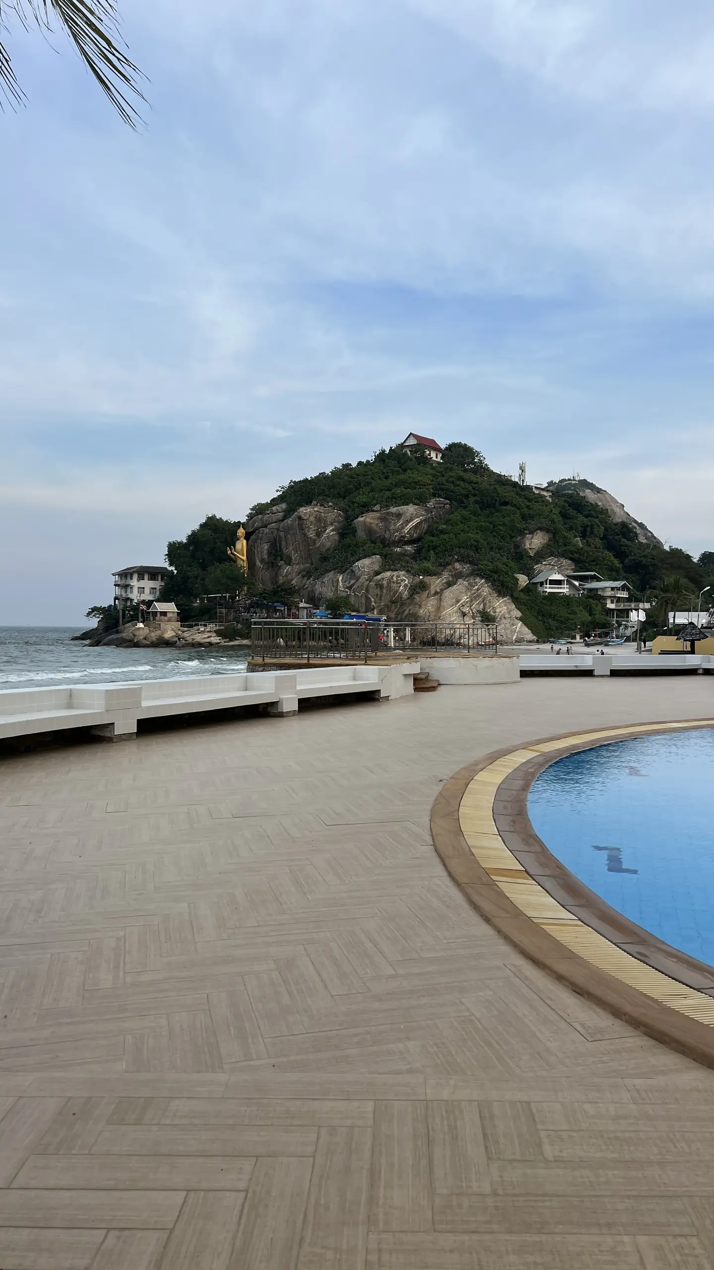 Community pool deck facing Monkey Mountain and the sea
